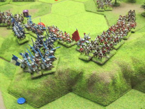 Yorkist cavalry attack the Lancastrian infantry on top of the escarpment